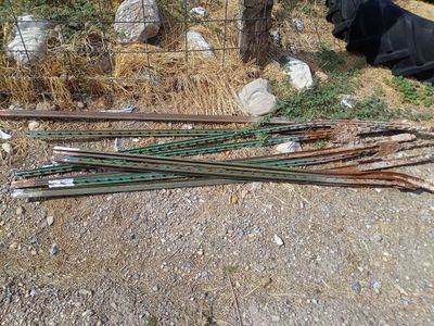 FREE!!! 9 Fence Posts, some are bent up.