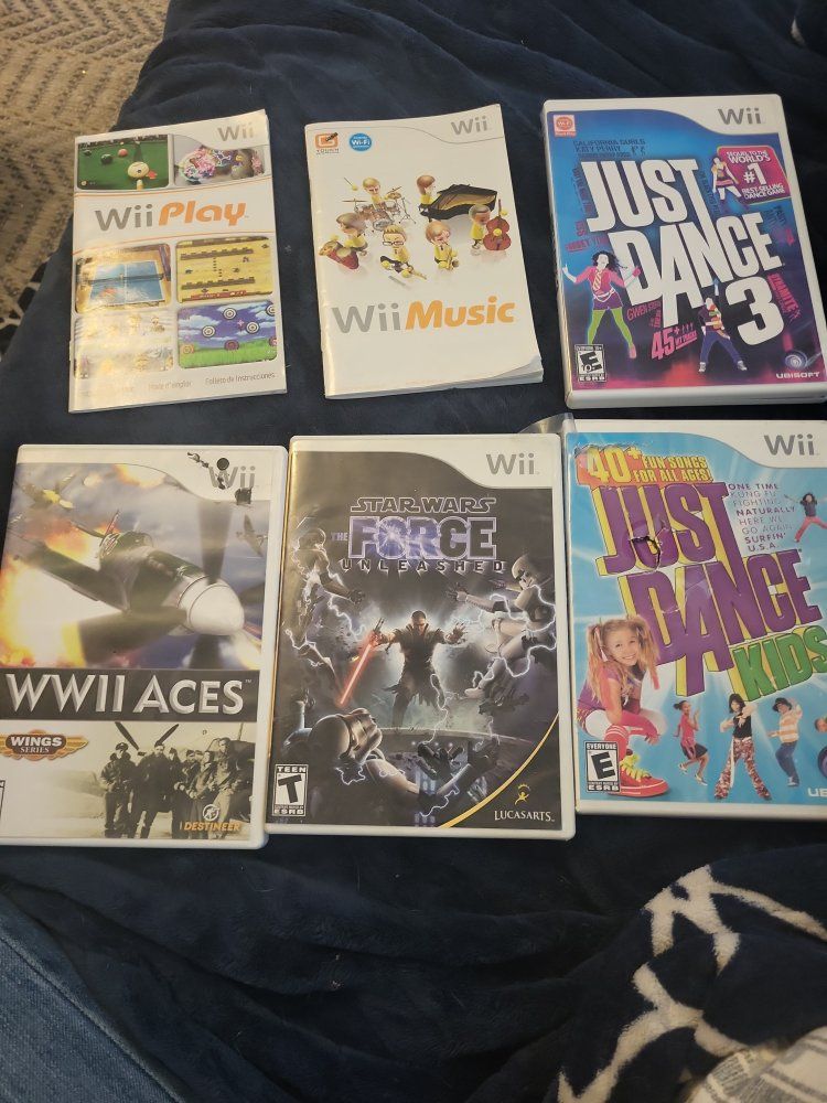 Nintendo Wii Lot no games just sases and some instruction books Just Dance, Star Wars, Wii Play, Wii Music, WWII Aces