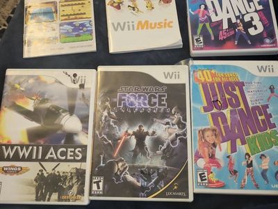 Nintendo Wii Lot no games just sases and some instruction books Just Dance, Star Wars, Wii Play, Wii Music, WWII Aces