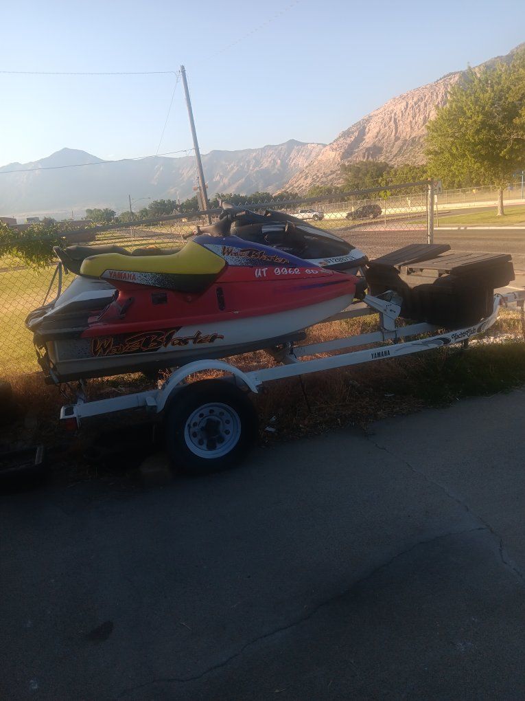 2 wave runners with trailer