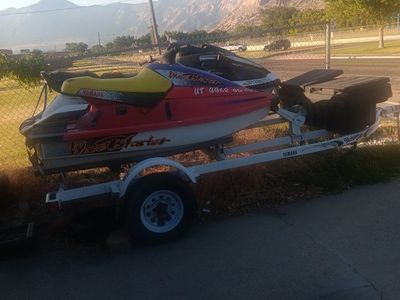 2 wave runners with trailer