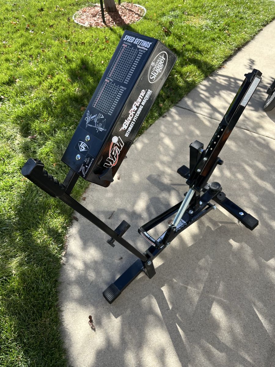 Louisville Slugger Black Flame UPM Ultimate Pitching Machine - Portable Baseball/Softball Trainer