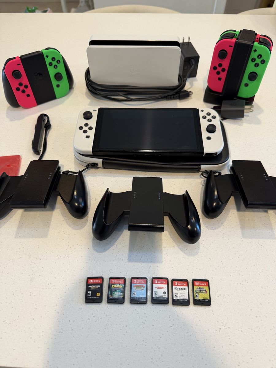 Nintendo Switch OLED Model Bundle with Dock, Charging Grips, and 6 Games - Excellent Condition- $390