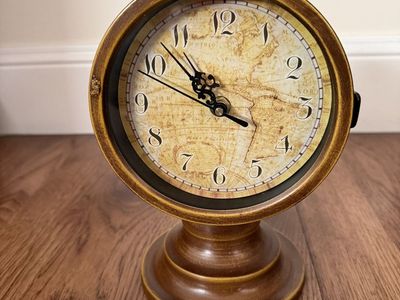 Clock for table or mantle 8.5 inches high and 6 inches wide. Excellent condition.