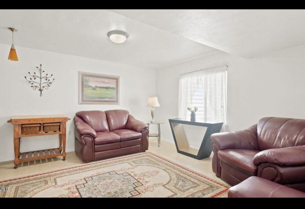 Burgundy Living Room Sofa Set (Includes side table, bookshelf, bar cart, area rug, ottoman and lamp).