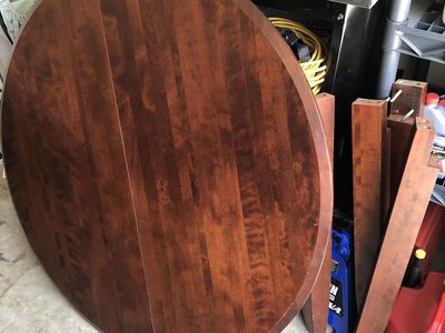 Round brown table w/ beveled glass top
