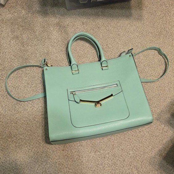 Robin egg blue. Leather Handbag with Shoulder Strap and Gold Hardware. Great temple bag. lightly used. 
smoke free/pet free