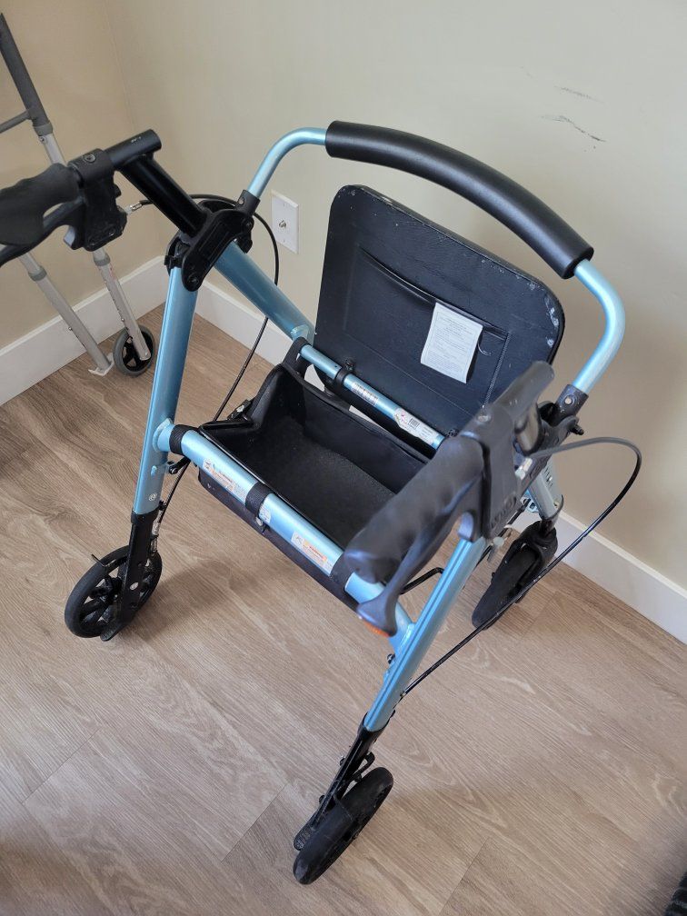 Light Blue Mobility Walker with Seat, Brakes, and Storage Basket for Adults