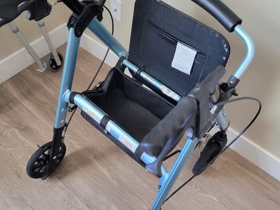 Light Blue Mobility Walker with Seat, Brakes, and Storage Basket for Adults
