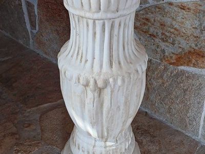 Statue or a flower pot pedestal.