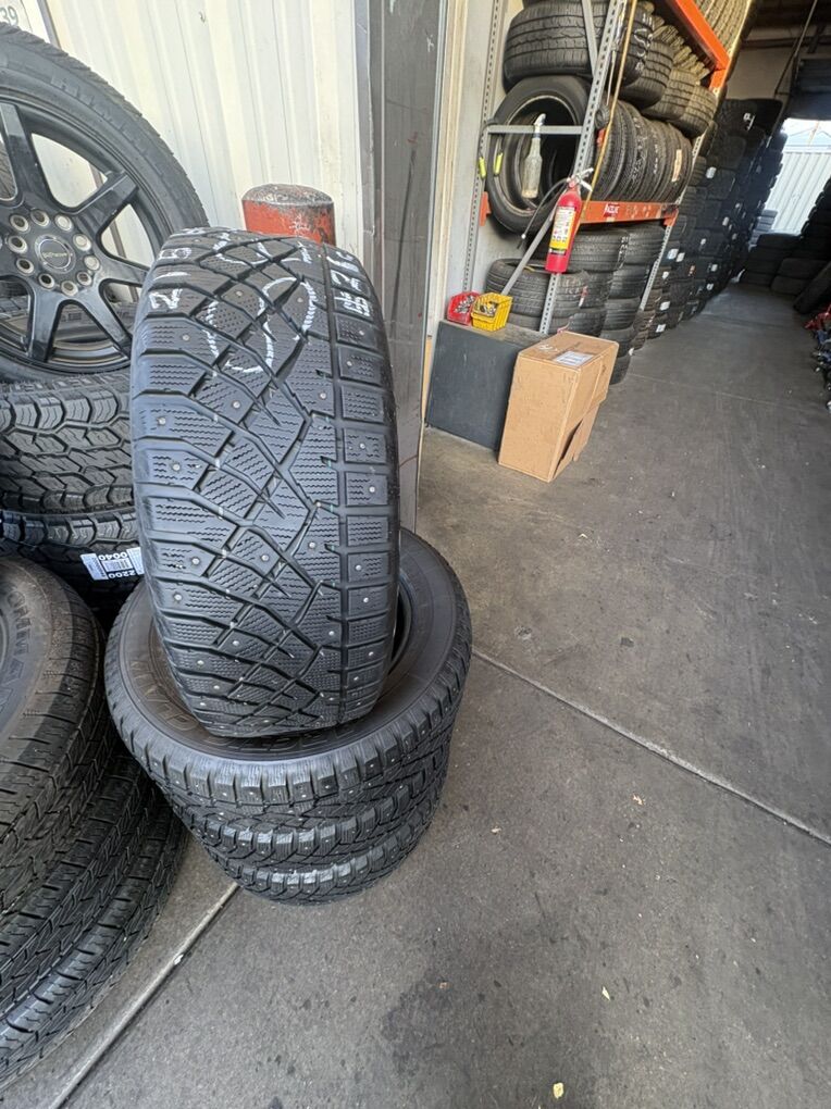 USED SET OF ARTIC CLAW 225/60R16