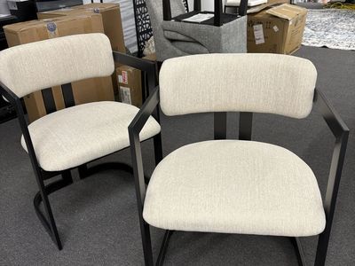 2 white modern chairs