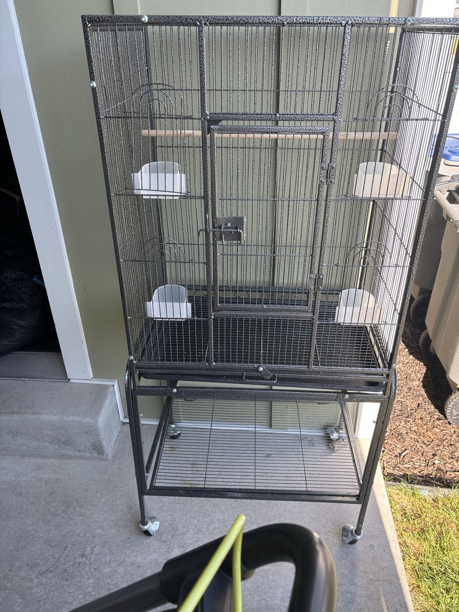 Black Metal Bird Cage on Wheels with Stand, Perch, and Feeders. For canaries and finches