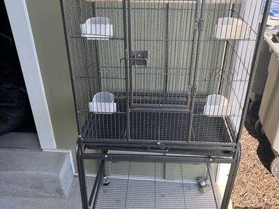 Black Metal Bird Cage on Wheels with Stand, Perch, and Feeders. For canaries and finches