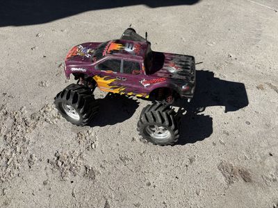 Traxxas E-Maxx RC Monster Truck with Dual Titan Motors and Controller - Purple/Orange Body $200 cash/venmo in Draper