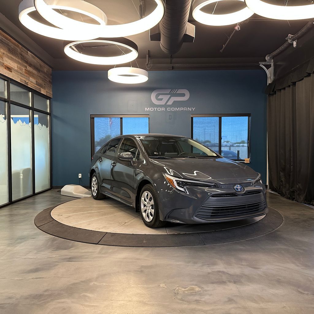 2023 Toyota Corolla Hybrid LE — rebuilt & branded title, 2% below market