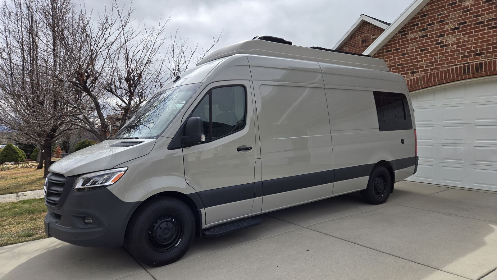 Custom camper van with wheelchair lift, solar power and power pop top.  Sleeps 4 Adults
