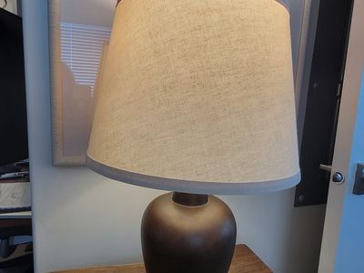 Two lamps brown base textured cream shade