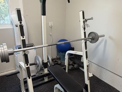 Weight Rack, Bench, Barbell, and Plates