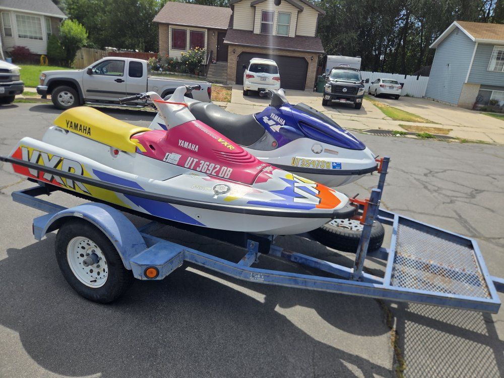 Two yamaha jet skis and trailer