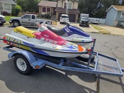 Two yamaha jet skis and trailer