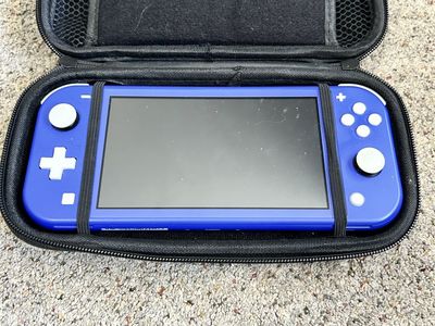 Nintendo Switch Lite Handheld Gaming Console in Blue with Carrying case