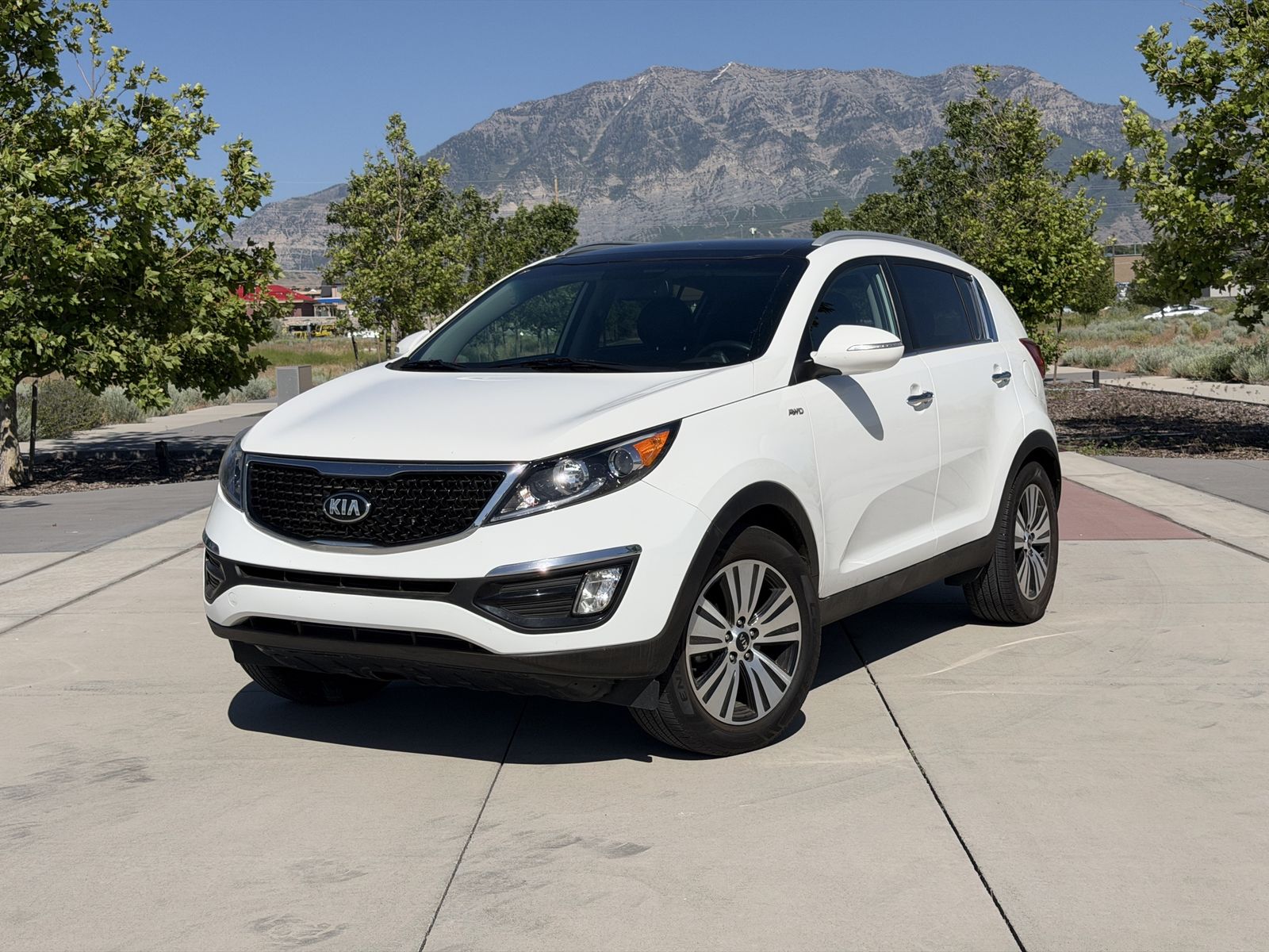 2016 Kia Sportage EX — rebuilt & branded title, 13% below market