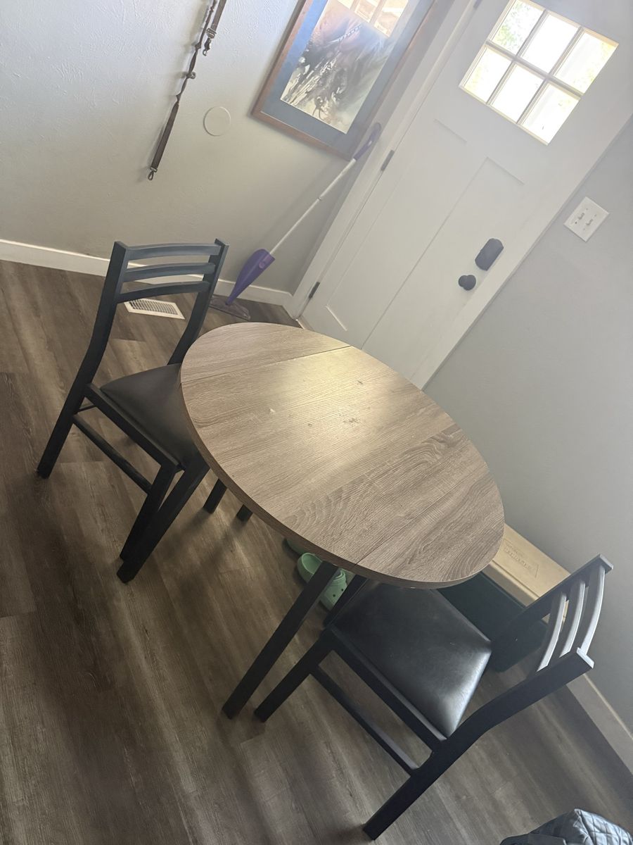 Compact 3-Piece Dining Set: Round Wood Table with 2 Black Metal and Faux Leather Chairs