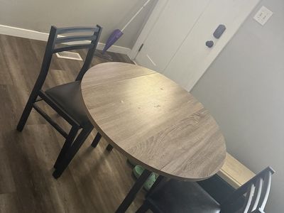 Compact 3-Piece Dining Set: Round Wood Table with 2 Black Metal and Faux Leather Chairs