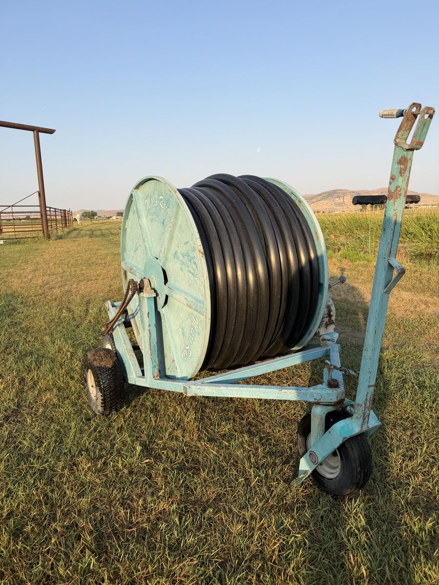 Micro rain, self retracting irrigation sprinkler