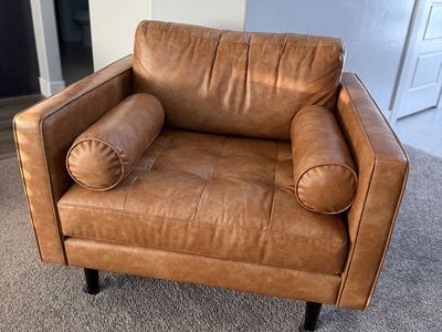 Modern Tan Faux 2 Leather Sofas with Tufted Seating & Bolster Pillows and chair