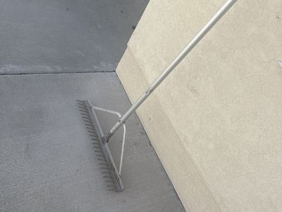 Landscaping leveling rake