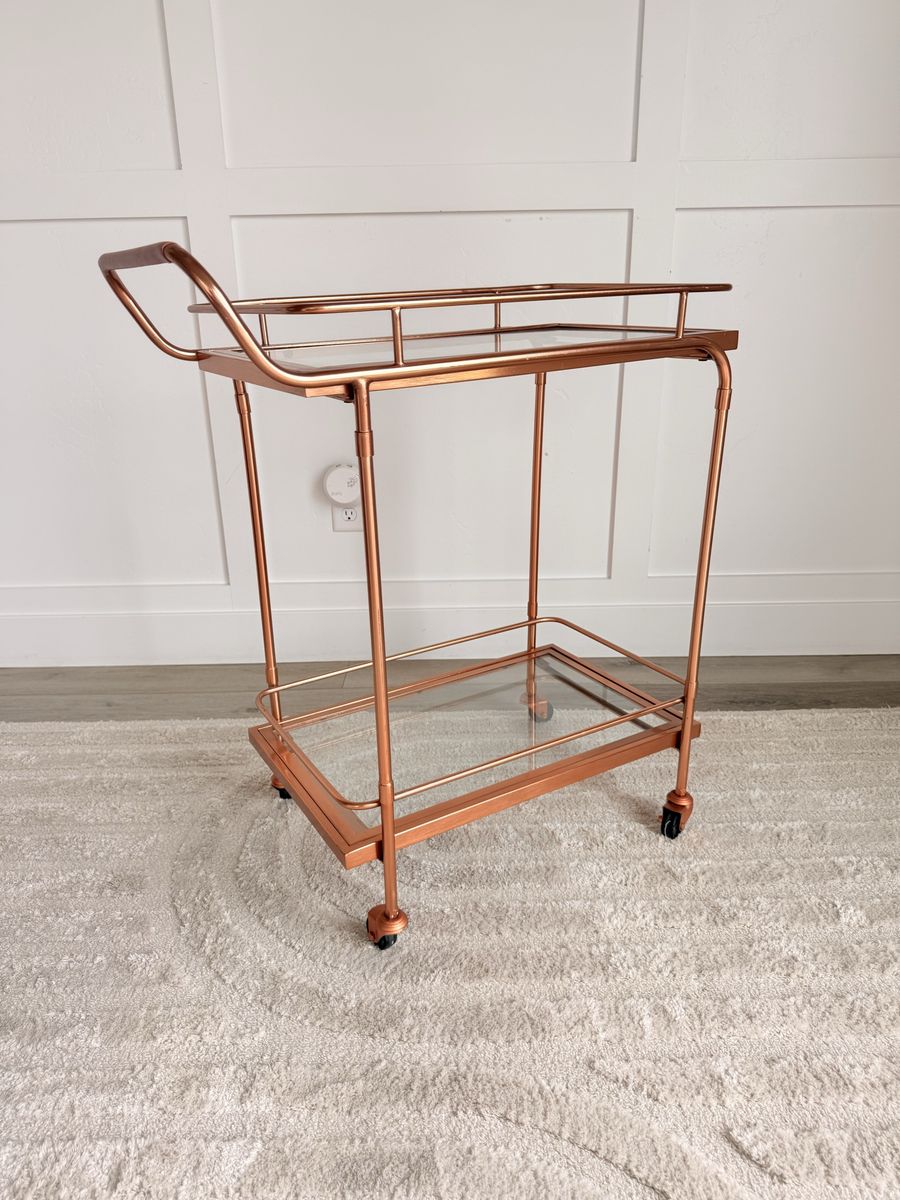Modern Rose Gold Metal and Glass Two-Tier Bar Cart with Wheels