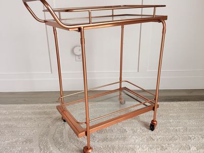 Modern Rose Gold Metal and Glass Two-Tier Bar Cart with Wheels