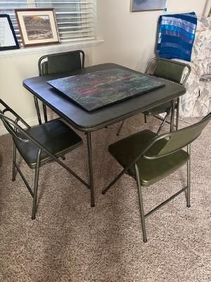Green card table with four chairs