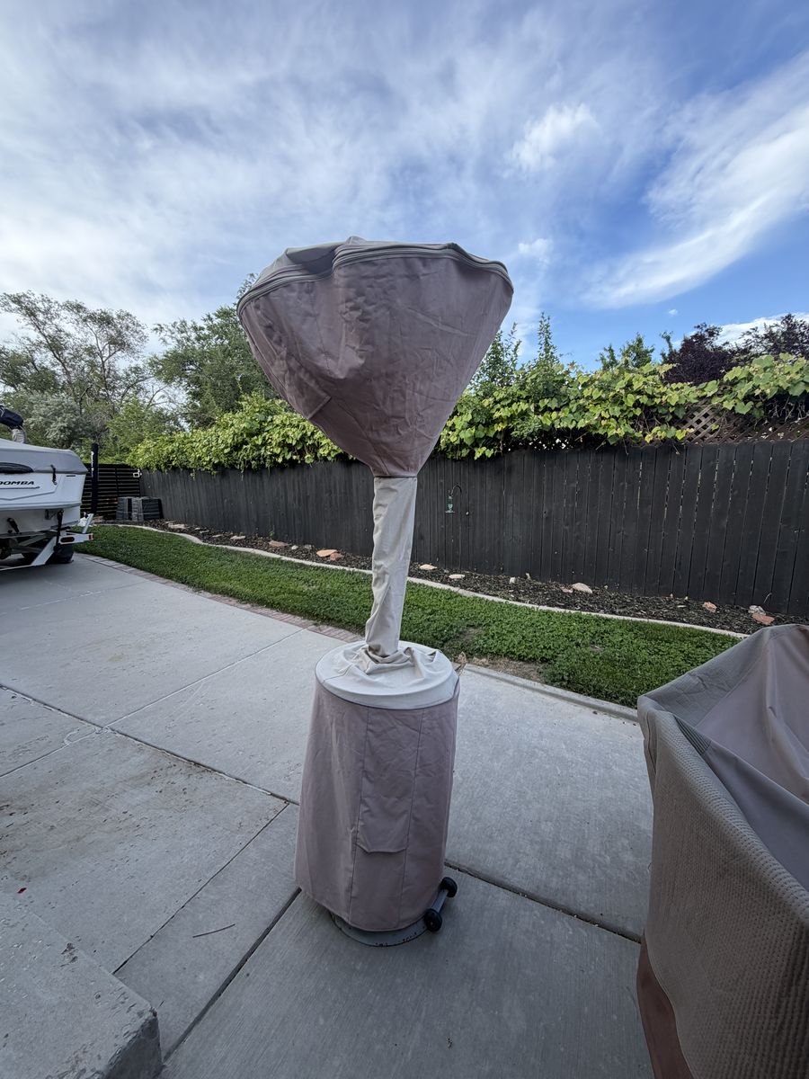 Stainless patio heater with cover, perfect for evenings!