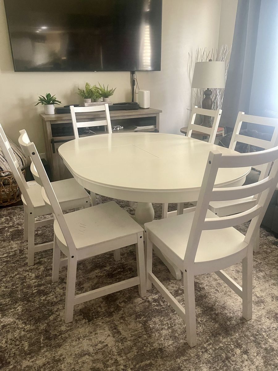 White wooden dining room set with 6 chairs