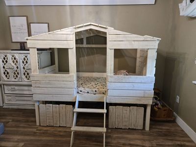 Tree house twin bed frame with matching storage bins