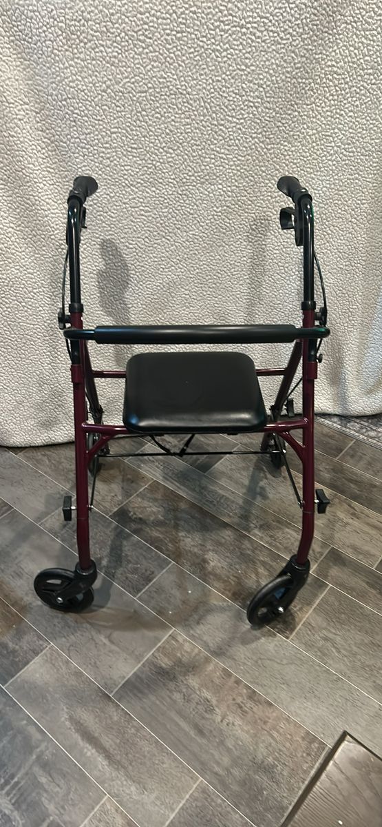 Burgundy 4-Wheel Folding Rollator Walker with Padded Seat and Hand Brakes