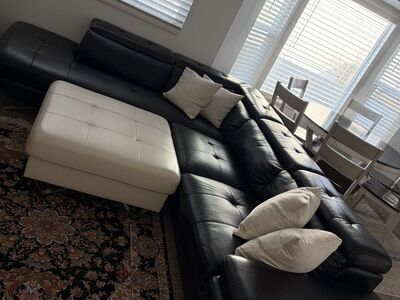 Black Leather Sectional with White Leather Coffee Table.