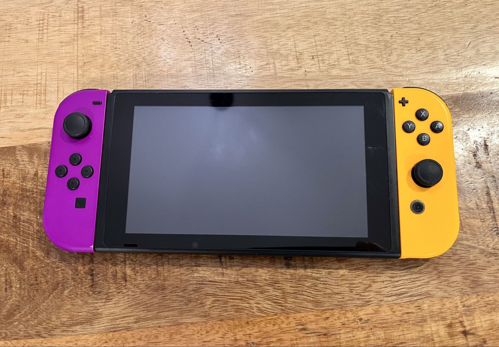 Nintendo Switch v2 with Neon Purple & Orange Joy-Cons + 4 Games Bundle