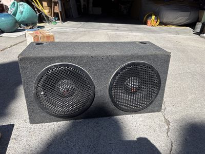 Car, audio speakers, and amp