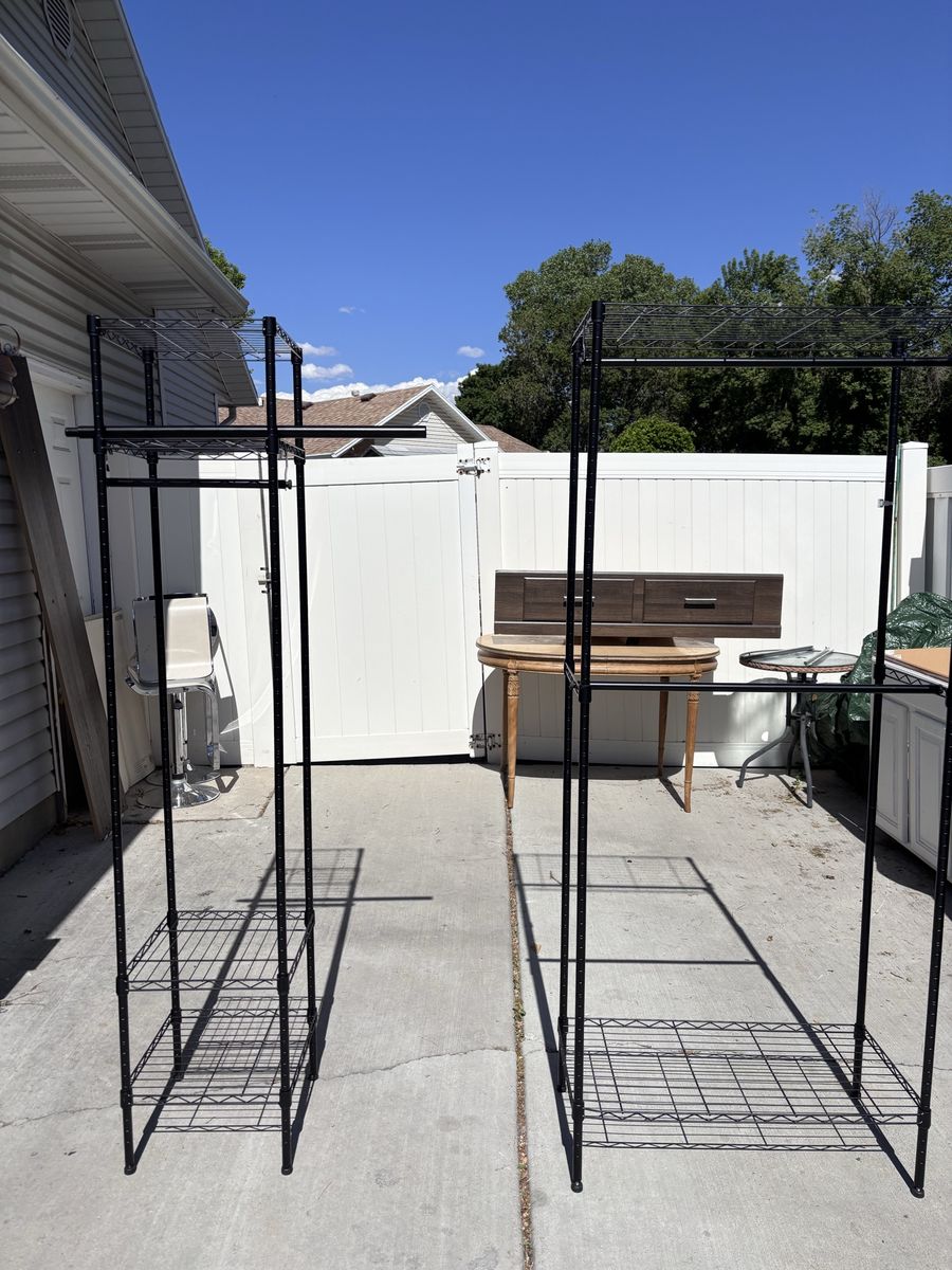Black Steel Freestanding Adjustable Clothes Rack With Shelves And Rods.