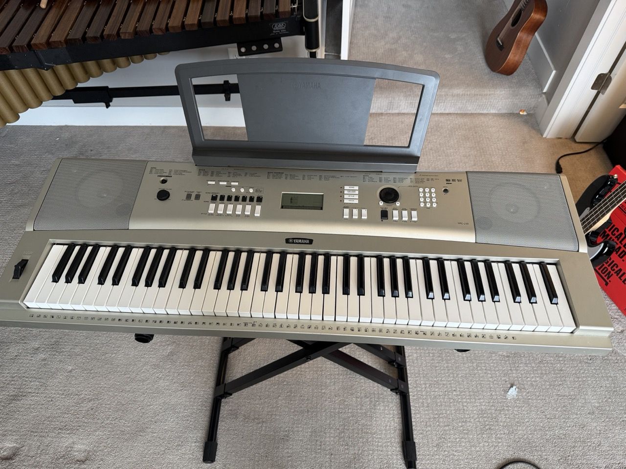 Yamaha YPG-235 digital keyboard with stand, bench, and sustain pedal