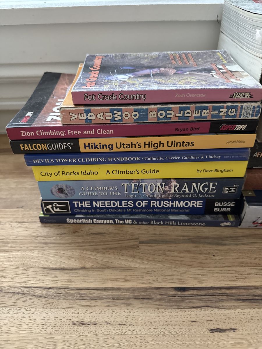 Stack of western climbing guide books