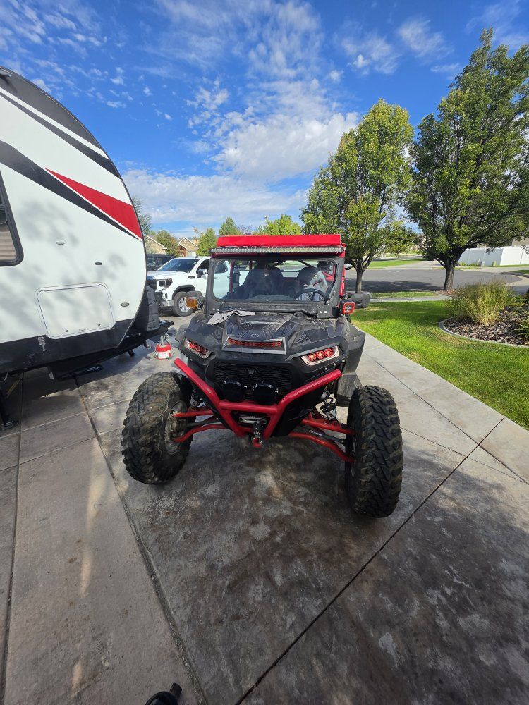 Polaris RZR UTV Side-by-Side with Vent Racing Roof and Triple X Seats