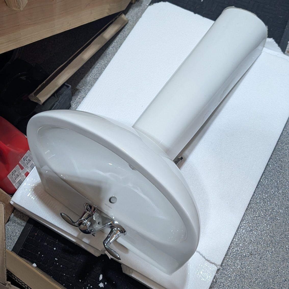 standing white ceramic sink + faucet + mirror