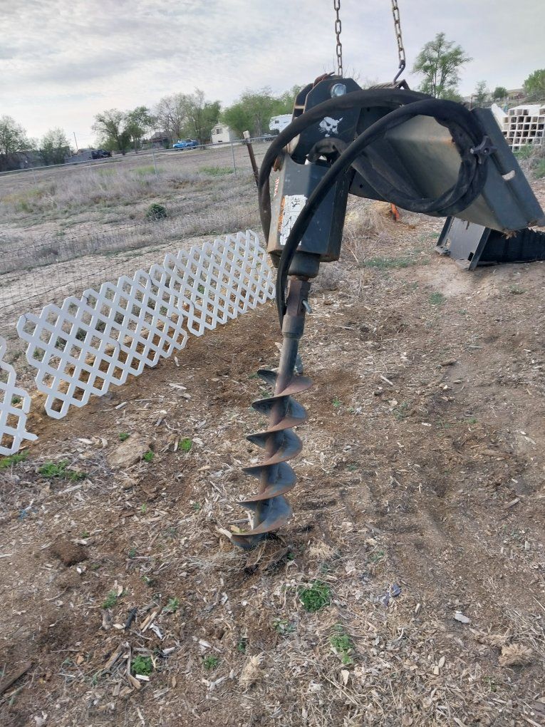 Bob Cat post hole digger