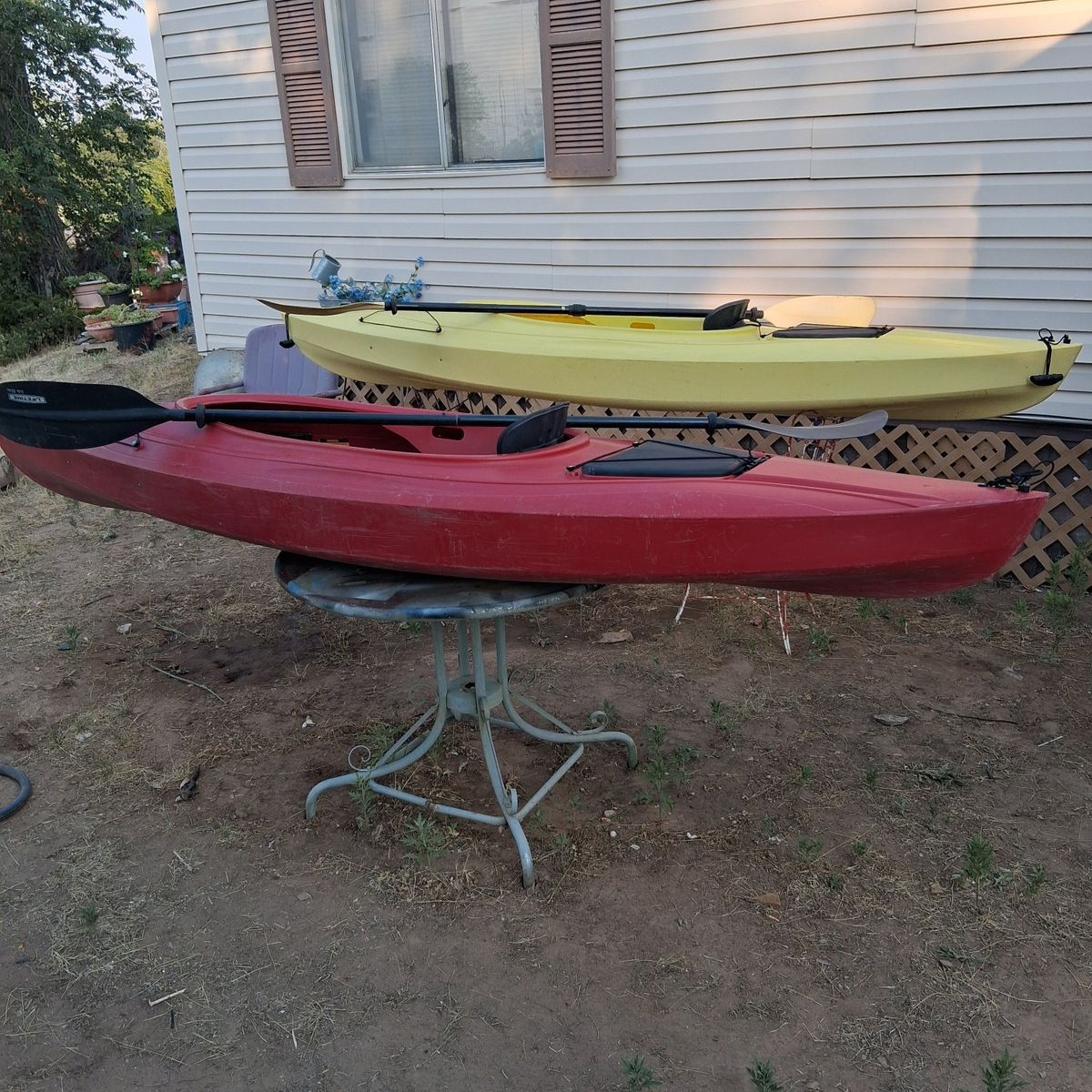 2 sit in kayaks