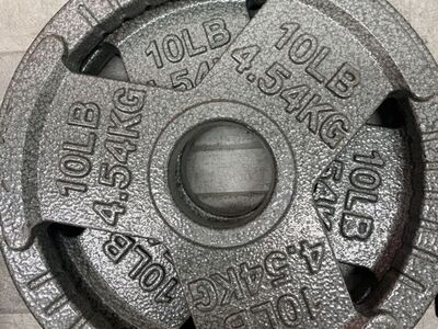 4ea 45LB AND 4ea 10LB PLATES barbell weights